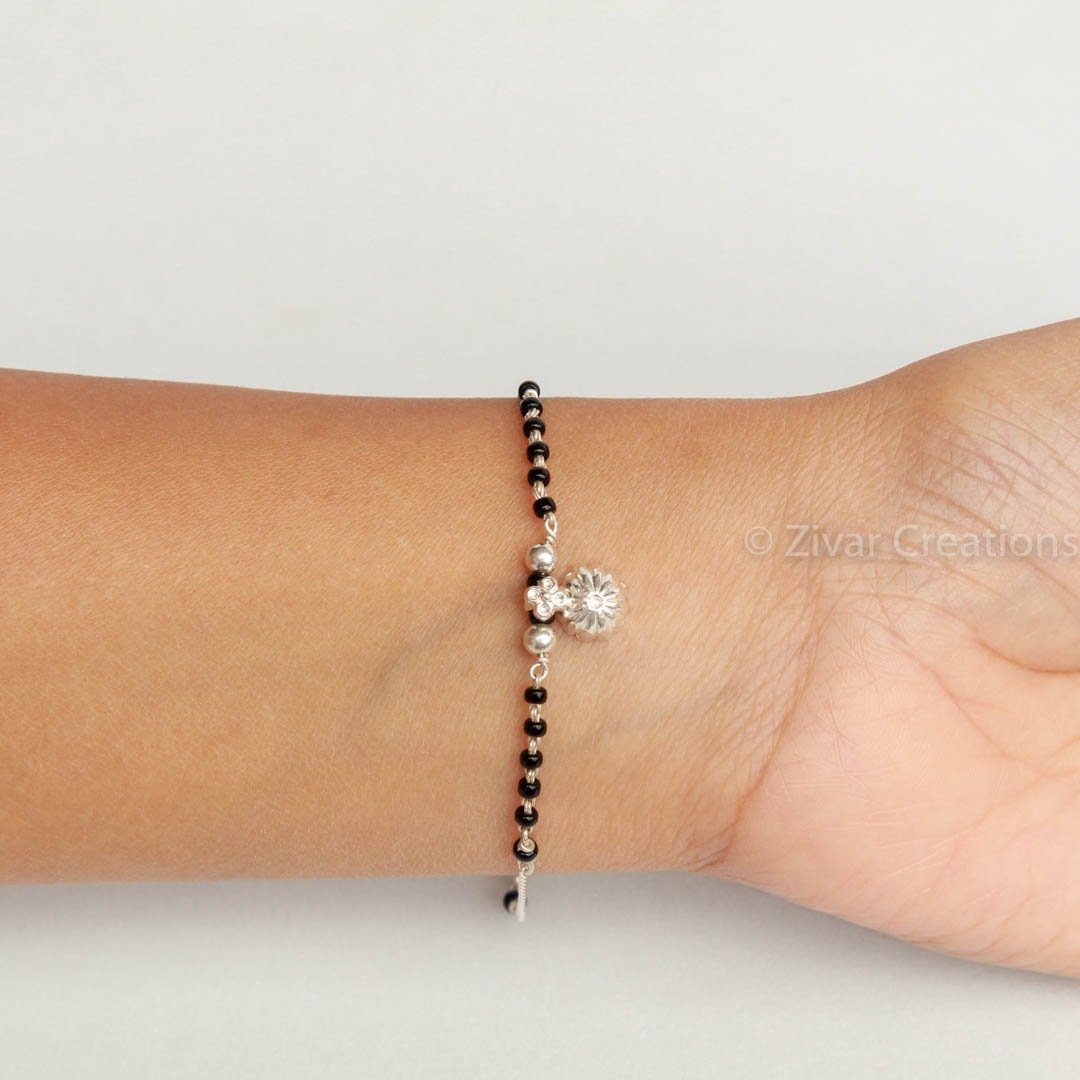 Cluster Diamond Bracelet Mangalsutra | Black beaded jewelry, Black beads  mangalsutra design, Mangalsutra bracelet