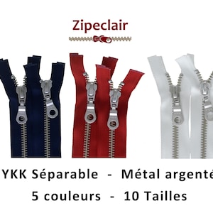 May include: Five zipper closures in different colors: black, navy blue, red, white, and olive green. The zippers are separated and have silver metal teeth. The text "YKK Séparable - Métal argenté 5 couleurs - 10 Tailles" is below the zippers.