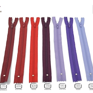 May include: Assortment of 8 zipper closures in various colors, including red, burgundy, purple, and lavender. Each zipper is 30 cm long.