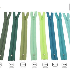 May include: Eight different colors of 30-inch zipper closures. The colors are khaki, green, light green, lime green, turquoise, and blue.