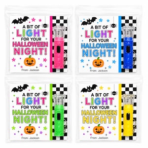May include: Four clear plastic bags containing small flashlights with keychains attached to cards. The cards feature a black and white checkered border, a pumpkin, a bat, a spider, stars, and the text A BIT OF LIGHT FOR YOUR HALLOWEEN NIGHT! From: Jackson.