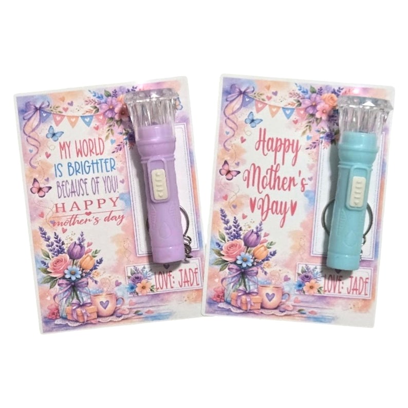 May include: Two small flashlights, one lavender and one teal, are attached to Mother's Day cards. The cards have floral designs and read "My World Is Brighter Because of You! Happy Mother's Day" and "Happy Mother's Day."