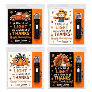 May include: Four clear plastic favor bags, each containing a black mini flashlight and a card. The cards feature Thanksgiving graphics, including a truck, scarecrow, pumpkin, and turkey, with the text A little bit of LIGHT and a whole lot of THANKS Happy Thanksgiving! From: Lauren.