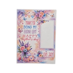 May include: A Mother's Day card with a watercolor design. The card features text that reads "Thanks for being my guiding light, Happy Mother's Day." It includes illustrations of flowers, butterflies, and a coffee cup. The card is personalized with the name "Jade."