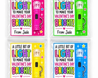 May include: Four clear plastic bags containing small flashlights with keychains. Each bag features a card with the text A LITTLE BIT OF LIGHT TO MAKE YOUR VALENTINE'S DAY BRIGHT! From: Jade. The flashlights are pink, green, yellow, and blue.