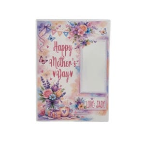 May include: A rectangular photo frame with a watercolor design. The frame features the text "Happy Mother's Day" and a blank space for a photo. Floral and butterfly accents in pink, purple, and blue decorate the frame. The text "LOVE JADE" is also present.