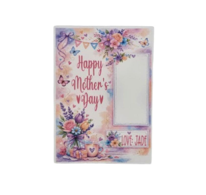 May include: A rectangular photo frame with a watercolor design. The frame features the text "Happy Mother's Day" and a blank space for a photo. Floral and butterfly accents in pink, purple, and blue decorate the frame. The text "LOVE JADE" is also present.