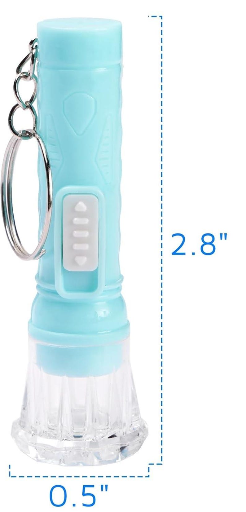 May include: A light blue flashlight with a clear, textured bottom. The flashlight is 2.8 inches tall and 0.5 inches wide. It has a silver keyring attached and a white button panel. The flashlight is cylindrical in shape.