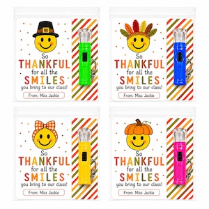 May include: Four clear plastic bags each containing a small LED flashlight and a card. The cards feature smiley faces with different hats, the text So THANKFUL for all the SMILES you bring to our class!, and the signature From: Miss Jackie.