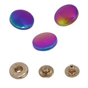 May include: Three iridescent rainbow coloured snap buttons and three gold metal snap button fasteners.
