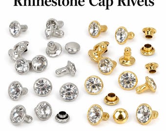 May include: An assortment of rhinestone cap rivets in silver and gold tones. The rivets feature clear, faceted rhinestones and are displayed against a white background. The text "Rhinestone Cap Rivets" is at the top of the image.