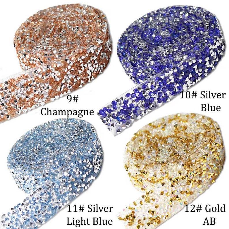 May include: Four rolls of rhinestone trim in different colors: champagne, silver blue, silver light blue, and gold AB. Each roll is labeled with a number and color name.
