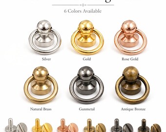 Könnte beinhalten: Schraub-Ring-Nieten in sechs Farben: Silber, Gold, Roségold, Naturmessing, Gunmetal und Antikbronze. Jeder Niet hat einen Ring und einen Schraubenrücken. Das Bild zeigt die Nieten und ihre Schraubenrücken.