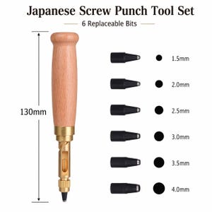 May include: Japanese screw punch tool set with 6 replaceable bits. The tool has a wooden handle and brass accents. The set includes six black screw punch bits, ranging from 1.5mm to 4.0mm. The tool is 13cm in length.