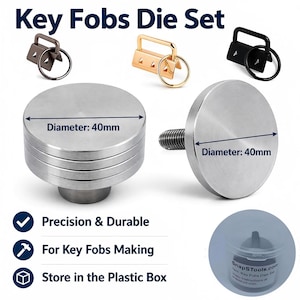 May include: A key fobs die set with the text "Key Fobs Die Set". The set includes metal key fob hardware in black, gold, and bronze. The set also includes two silver metal dies, each with a 40mm diameter. The text "Precision & Durable", "For Key Fobs Making", and "Store in the Plastic Box" are also included.