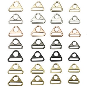 Puede incluir: Surtido de 20 hebillas deslizantes de metal de forma triangular en varios acabados, incluyendo oro, plata, oro rosa, negro y latón antiguo.