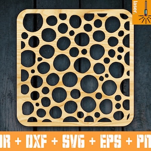 May include: A laser cut wooden panel with a repeating pattern of circles of varying sizes. The panel is light brown and has a smooth, polished finish.