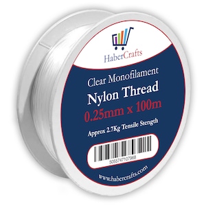 May include: A spool of clear monofilament nylon thread, 0.25mm thick and 100m long. The spool is labeled "Clear Monofilament Nylon Thread 0.25mm x 100m" and "Approx 2.7Kg Tensile Strength".