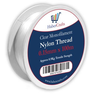 May include: A spool of clear monofilament nylon thread, 0.15mm thick and 100 meters long. The spool is labeled "Clear Monofilament Nylon Thread 0.15mm x 100m" and "Approx 0.9Kg Tensile Strength".