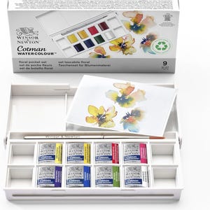 May include: A white Winsor & Newton Cotman WATERCOLOUR floral pocket set. The set contains nine watercolour paints, a paintbrush, and a floral design on a piece of paper. The box has the text "floral pocket set".