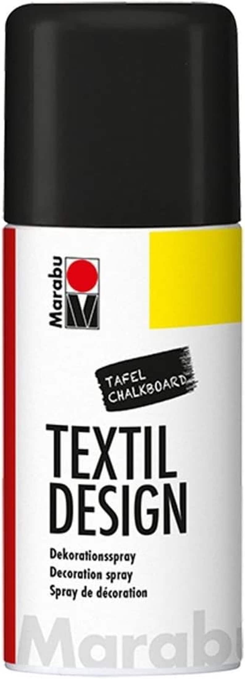 May include: A black spray paint can with a white label. The label says "Marabu Textil Design" and "Decoration spray". There is a yellow rectangle on the label.