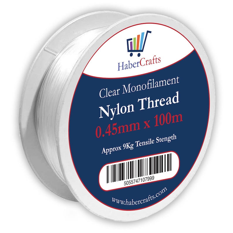 May include: A spool of clear monofilament nylon thread, 0.45mm thick and 100m long. The spool has a blue label with the text "Clear Monofilament Nylon Thread 0.45mm x 100m" and "Approx 9Kg Tensile Stength". The label also includes a barcode and the website address "www.habercrafts.com".