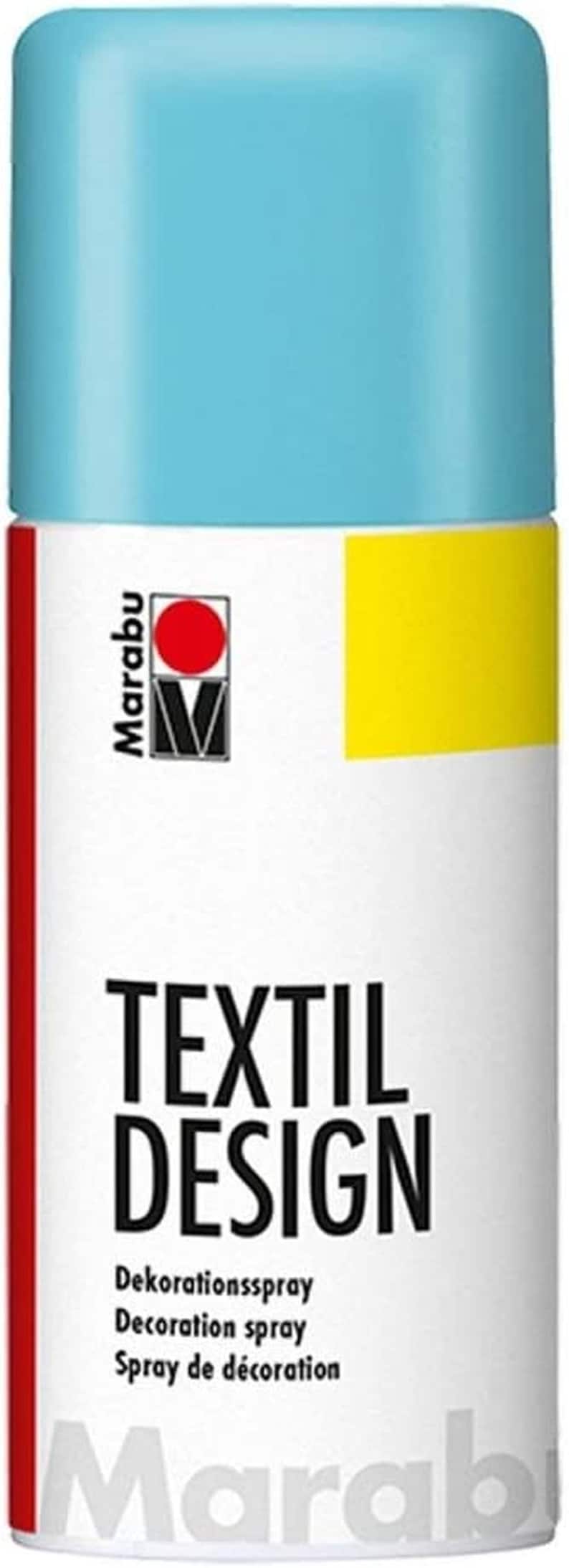 May include: A blue spray paint can with the text "TEXTIL DESIGN" and "Dekorationsspray Decoration spray Spray de d&eacute;coration" on the front. The can is labeled with the Marabu brand logo.