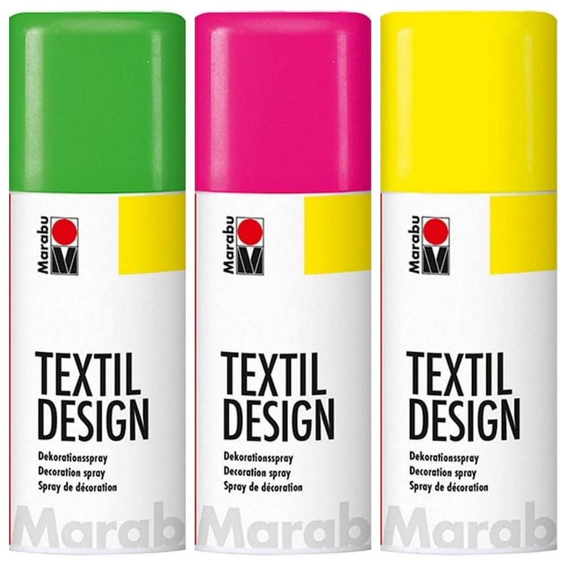 May include: Three spray paint cans for fabric. The cans are labeled "Marabu Textil Design" and are green, pink, and yellow.