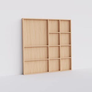 May include: A light wood wall shelf with 12 square compartments. The shelf is made of natural wood and has a simple, modern design.
