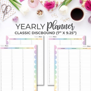 May include: A yearly planner with pastel colored tabs for each month. The planner is 7 inches by 9.25 inches and is designed for discbound systems.