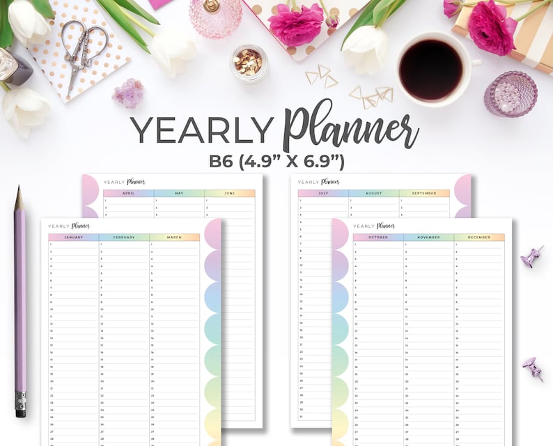 May include: A yearly planner with a pastel rainbow design. The planner is B6 size, measuring 4.9" x 6.9". The pages are divided by month, with space for notes. The text "YEARLY Planner" is at the top of each page.