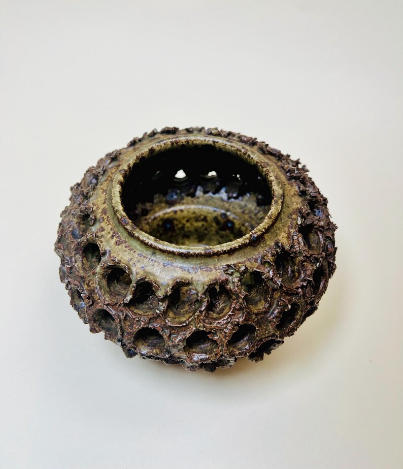 Vintage Brutalist style candle holder by Frank Milo Tromborg from the 1970s, featuring a textured, rustic design with circular cutouts, perfect for wabi sabi and vintage décor enthusiasts.