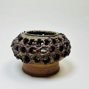 Vintage Brutalist style candle holder by Frank Milo Tromborg from the 1970s, featuring a textured, rustic design with circular cutouts, perfect for wabi sabi and vintage décor enthusiasts.