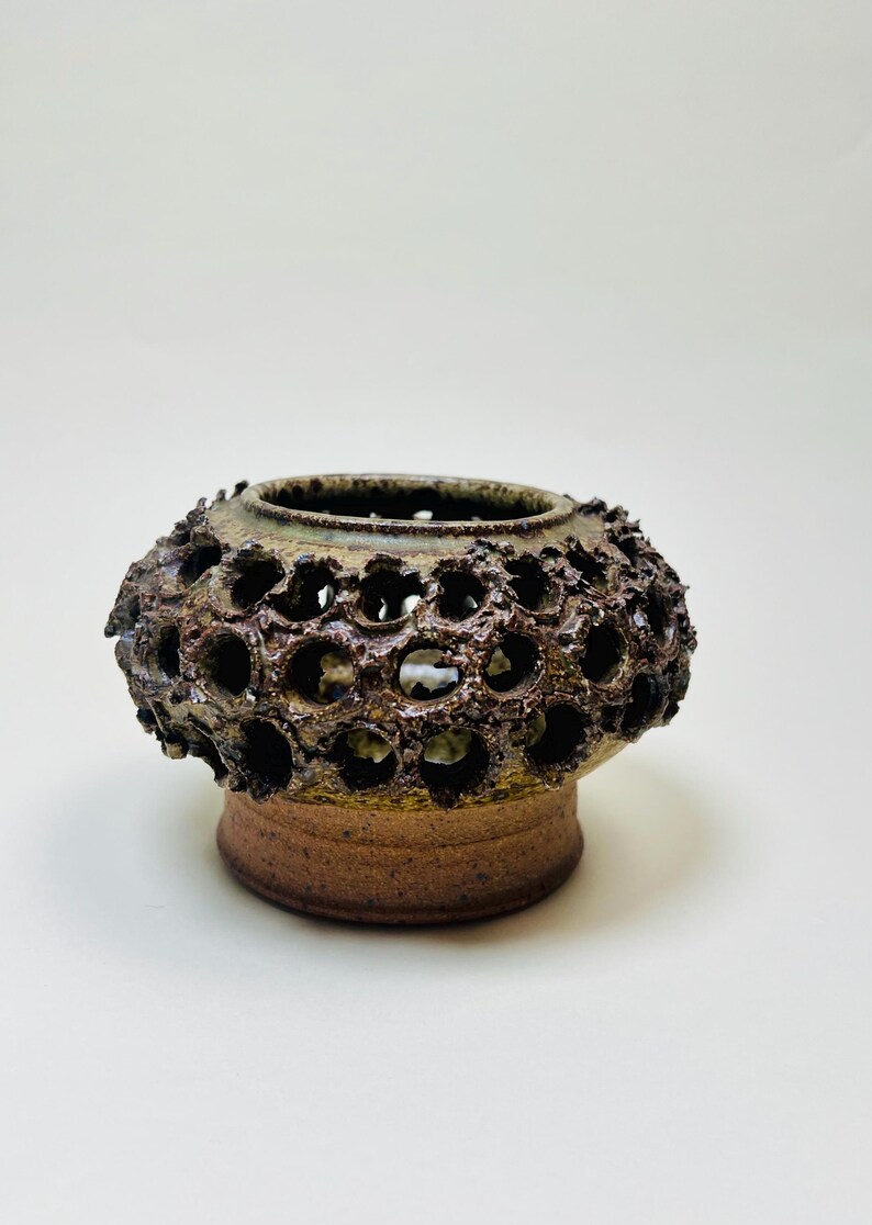 Vintage Brutalist style candle holder by Frank Milo Tromborg from the 1970s, featuring a textured, rustic design with circular cutouts, perfect for wabi sabi and vintage décor enthusiasts.