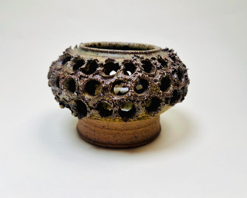 Vintage Brutalist style candle holder by Frank Milo Tromborg from the 1970s, featuring a textured, rustic design with circular cutouts, perfect for wabi sabi and vintage décor enthusiasts.