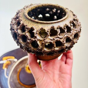 Vintage Brutalist style candle holder by Frank Milo Tromborg from the 1970s, featuring a textured, rustic design with circular cutouts, perfect for wabi sabi and vintage décor enthusiasts.