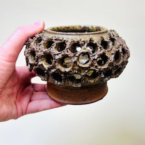 Vintage Brutalist style candle holder by Frank Milo Tromborg from the 1970s, featuring a textured, rustic design with circular cutouts, perfect for wabi sabi and vintage décor enthusiasts.