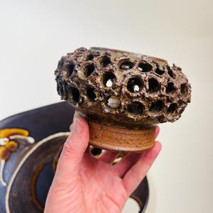 Vintage Brutalist style candle holder by Frank Milo Tromborg from the 1970s, featuring a textured, rustic design with circular cutouts, perfect for wabi sabi and vintage décor enthusiasts.