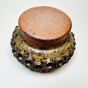 Vintage Brutalist style candle holder by Frank Milo Tromborg from the 1970s, featuring a textured, rustic design with circular cutouts, perfect for wabi sabi and vintage décor enthusiasts.