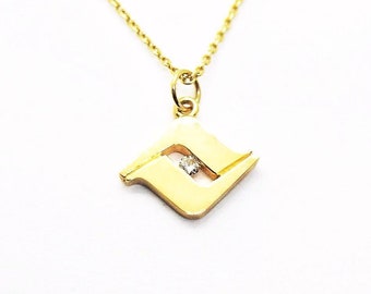 Howlithes Jewelry Vail Colorado ""V"" Anhänger mit Diamant in Gelbgold."