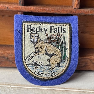 May include: A handmade wooden sign with the text "Welcome to our home" in a handwritten style. The sign is painted white with black lettering and a distressed finish, perfect for home decor.