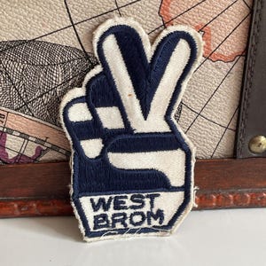 Parche vintage del West Bromwich Albion Football Club para aficionados, década de 1970.