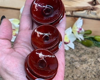 May include: Three wooden display stands in different sizes, with a glossy, dark red finish. The stands are numbered 9, 10, and 11, and are designed to hold and display crystals, rocks, or other small objects.