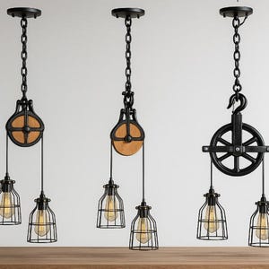 May include: Three industrial pendant lights with black metal pulley and cage designs. Each light features a chain, a pulley with a wooden wheel, and a cage-style light fixture with a visible bulb. The lights are suspended from the ceiling.