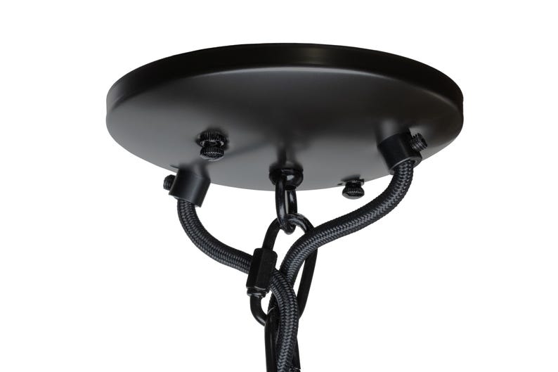 May include: A black ceiling rose with a circular design. It features three screws and two black fabric-covered wires. A black chain is suspended from the centre of the rose.