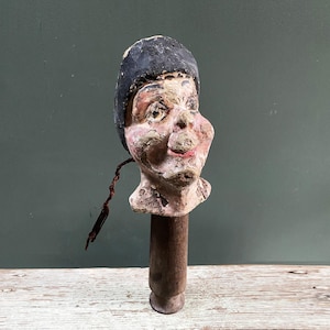 Antique Guignol head on wooden base
