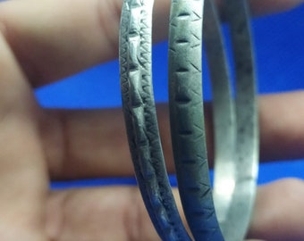 Moroccan Jewelry, lot 2 unmatched Saharan/Tuareg silver incised bangles, worn, solid, 2 3/8 inches diameter