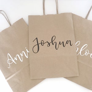 Handwritten personalised customised hen birthday party bag in brown kraft or white paper with silver, rose gold, white or black calligraphy