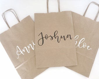 Handwritten personalised customised hen birthday party bag in brown kraft or white paper with silver, rose gold, white or black calligraphy
