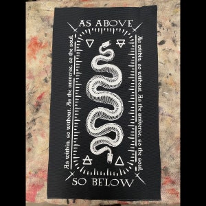 May include: Black patch with a white snake design and the text "AS ABOVE SO BELOW" with the phrase "As within, so without. As the universe, so the soul." repeated on either side of the snake.